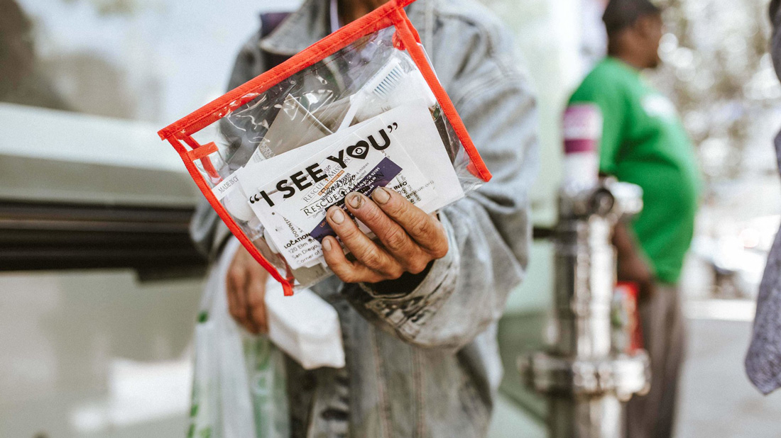 Man holding a hygiene kit